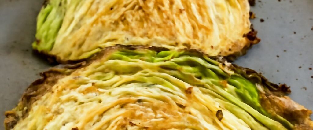 Browned and tender roasted cabbage wedges on a sheet pan