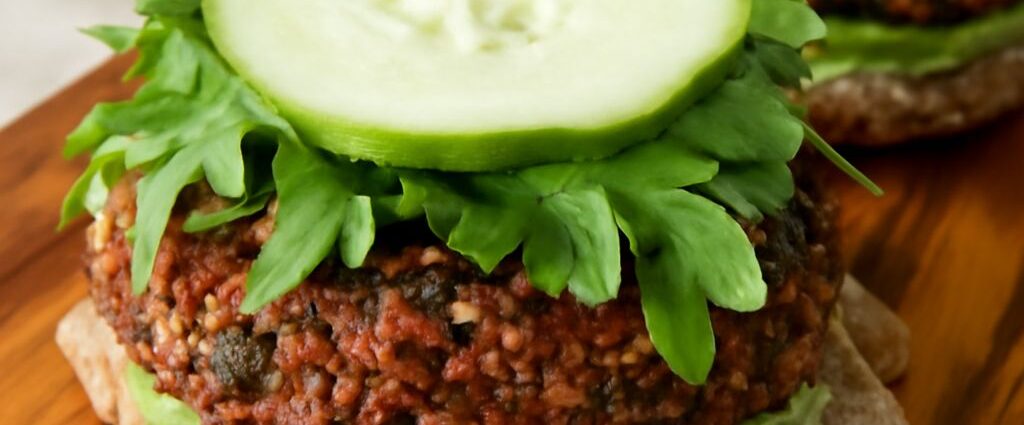 Vegan black bean burgers with browned edges and lettuce on toasted buns