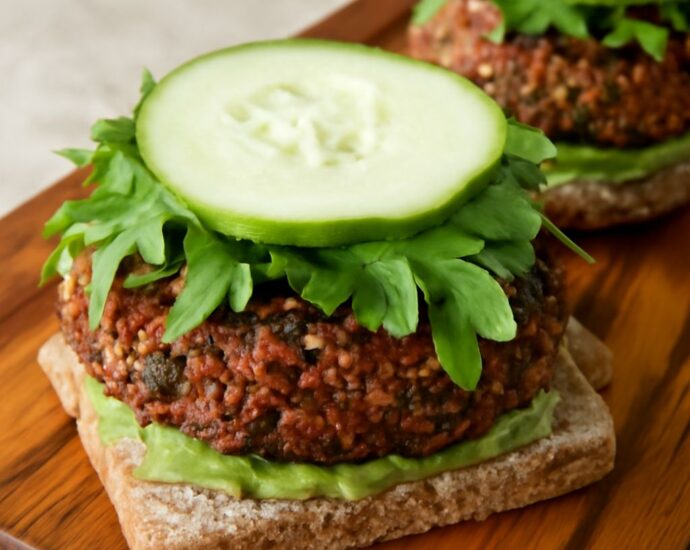 Vegan black bean burgers with browned edges and lettuce on toasted buns