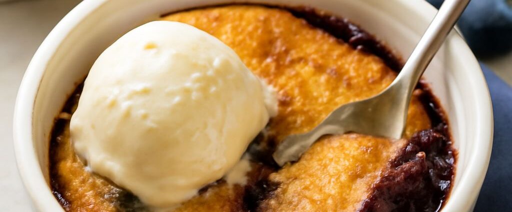 A freshly baked blueberry cobbler served in a dish.