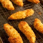 Breaded chicken tenders on a plate