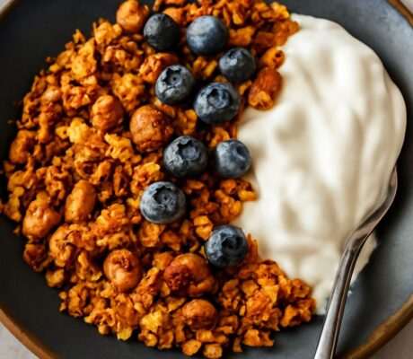 A bowl of homemade granola with nuts and dried fruits