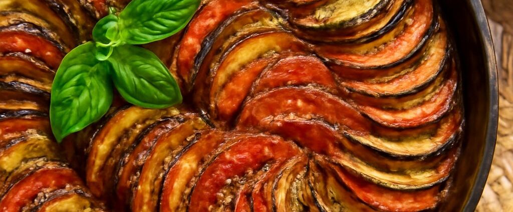 A beautifully layered ratatouille dish with vibrant vegetables