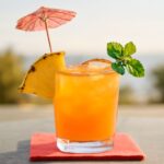 A classic Mai Tai cocktail garnished with lime and mint.