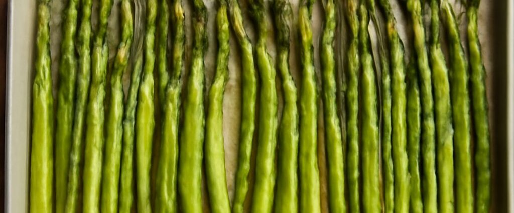 Oven roasted asparagus on a baking sheet