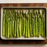 Oven roasted asparagus on a baking sheet
