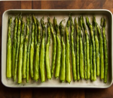 Oven roasted asparagus on a baking sheet