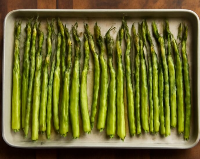 Oven roasted asparagus on a baking sheet